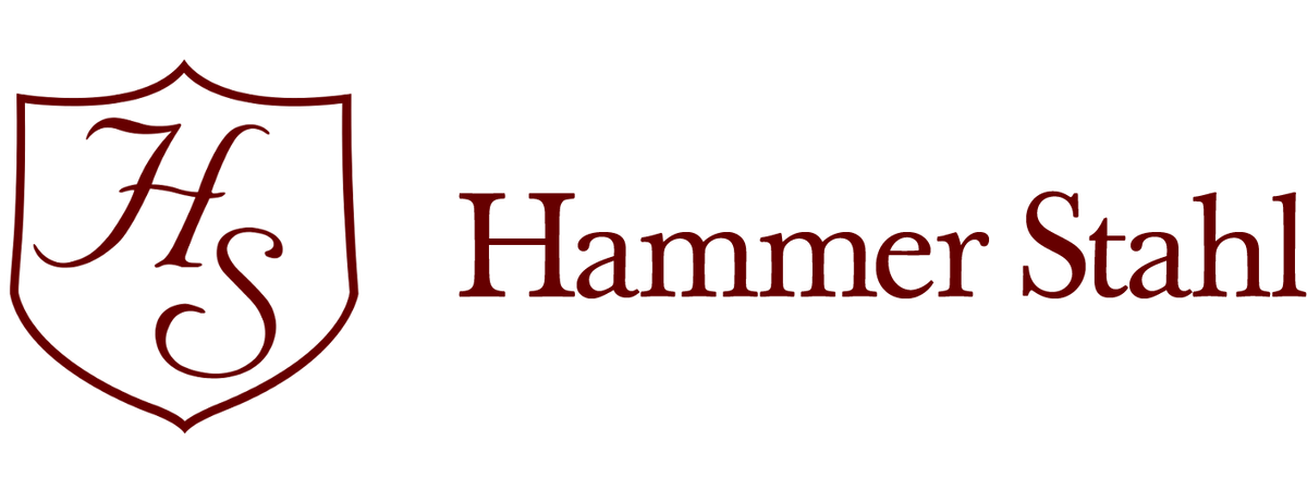 Logo of Hammer Stahl with a shield emblem and text on a white background